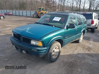 1997 Oldsmobile Bravada z VIN 1GHDT13W9V2705528, wystawiony jako IAAI lot #41583837 z przebiegiem 284 281 mil mil oraz . Historia ofert i sprzedaży dostępna na DreamBid. Obrazek 2.