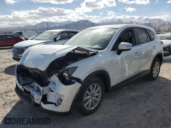 2015 Mazda CX-5 Touring with VIN JM3KE4CY7F0553862, listed as a Copart auction lot 48392725 with 122,530 mi miles and Salvage Title. Bid and sale history available at carsss.com. Image 1.