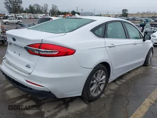 2020 Ford Fusion SE z VIN 3FA6P0LU2LR253612, wystawiony jako IAAI lot #41798850 z przebiegiem 58 219 mil mil oraz . Historia ofert i sprzedaży dostępna na DreamBid. Obrazek 4.