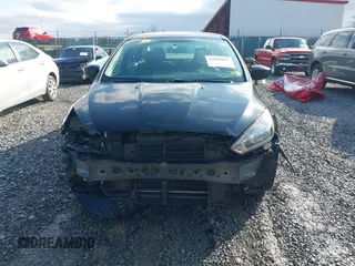 2018 Ford Focus SE z VIN 1FADP3FE9JL255818, wystawiony jako IAAI lot #42009017 z przebiegiem 79 329 mil mil oraz . Historia ofert i sprzedaży dostępna na DreamBid. Obrazek 13.