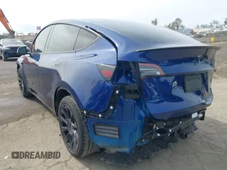 2022 Tesla Model Y Long Range with VIN 7SAYGDEE0NA019067, listed as a IAAI auction lot 41645198 with 49,336 mi miles and . Bid and sale history available at DreamBid. Image 3.