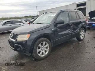 2009 Suzuki Grand Vitara z VIN JS3TE149794100133, wystawiony jako Copart lot #52919795 z przebiegiem 207 928 mil mil oraz Szkoda całkowita • Salvage title. Historia ofert i sprzedaży dostępna na DreamBid. Obrazek 1.