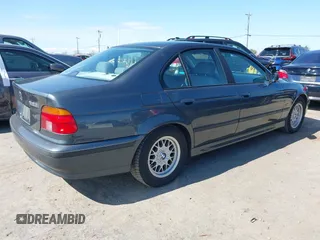 2000 BMW 5 Series 528iA with VIN WBADM6343YGV01651, listed as a IAAI auction lot 41745574 with 143,898 mi miles. Bid and sale history available at carsss.com. Image 4.