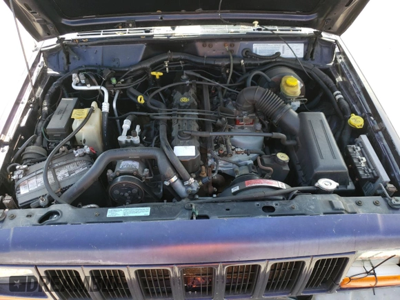 1999 Jeep Cherokee Sport z VIN 1J4FF68S8XL604061, wystawiony jako Copart lot #53175345 z przebiegiem 206 698 mil mil oraz Nie do naprawy • Non repairable. Historia ofert i sprzedaży dostępna na DreamBid. Obrazek 12.