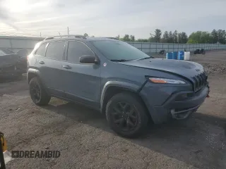 2014 Jeep Cherokee Trailhawk with VIN 1C4PJMBS3EW308706, listed as a Copart auction lot 58307975 with 90,530 mi miles and Salvage title. Bid and sale history available at DreamBid. Image 4.