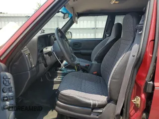 1999 Jeep Cherokee Sport with VIN 1J4FT68SXXL669549, listed as a Copart auction lot 62367015 with 194,446 mi miles and Salvage title. Bid and sale history available at DreamBid. Image 7.