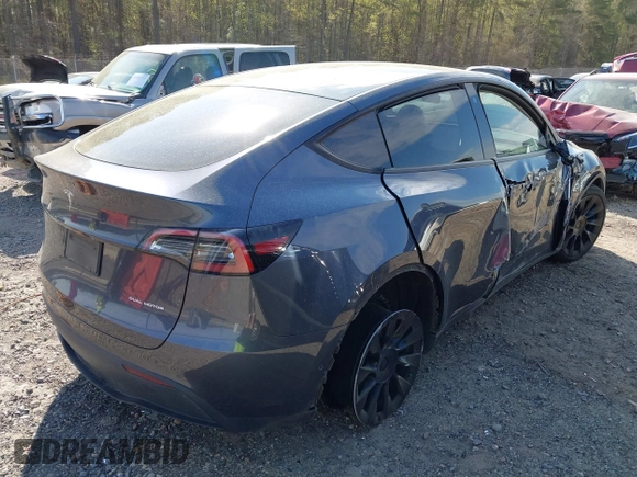 2022 Tesla Model Y Long Range z VIN 7SAYGDEE7NA006476, wystawiony jako IAAI lot #41894606 z przebiegiem 63 380 mil mil oraz . Historia ofert i sprzedaży dostępna na DreamBid. Obrazek 4.