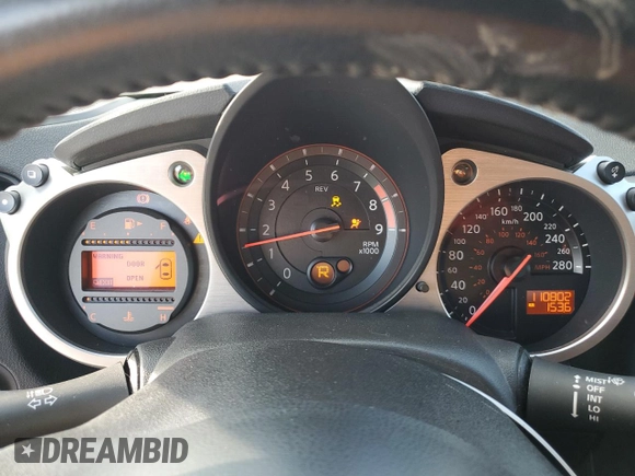 2014 Nissan 370Z z VIN JN1AZ4EH9EM636239, wystawiony jako Copart lot #69833264 z przebiegiem 110 802 mil mil oraz Szkoda całkowita • Salvage title. Historia ofert i sprzedaży dostępna na DreamBid. Obrazek 9.