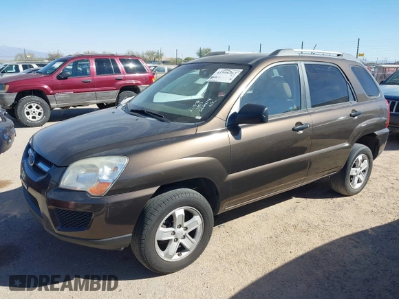 2010 Kia Sportage LX with VIN KNDKGCA32A7666414, listed as a IAAI auction lot 41598263 with 166,882 mi miles and . Bid and sale history available at carsss.com. Image 2.