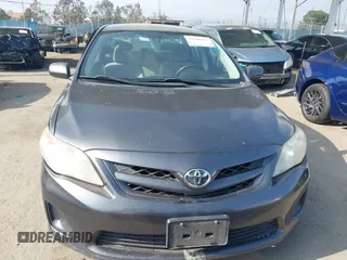 2011 Toyota Corolla L with VIN JTDBU4EE3BJ090749, listed as a IAAI auction lot 42106633 with 209,824 mi miles. Bid and sale history available at carsss.com. Image 13.
