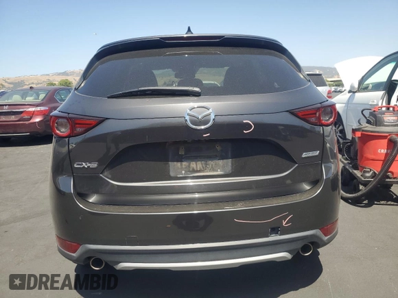 2018 Mazda CX-5 Grand Touring with VIN JM3KFADM3J1389911, listed as a Copart auction lot 60530295 with 103,177 mi miles and Salvage title. Bid and sale history available at DreamBid. Image 6.