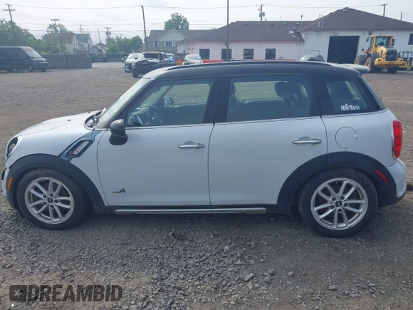 2015 MINI Countryman S with VIN WMWZC5C59FWM18935, listed as a IAAI auction lot 42427878 with 121,410 mi miles and . Bid and sale history available at DreamBid. Image 14.