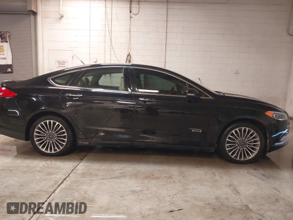 2017 Ford Fusion Titanium with VIN 3FA6P0SUXHR208653, listed as a IAAI auction lot 41312067 with 62,601 mi miles and . Bid and sale history available at DreamBid. Image 13.
