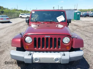 2010 Jeep Wrangler Sahara z VIN 1J4GA5D16AL227053, wystawiony jako IAAI lot #42219421 z przebiegiem 67 174 mil mil oraz . Historia ofert i sprzedaży dostępna na DreamBid. Obrazek 12.