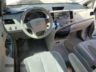 2012 Toyota Sienna with VIN 5TDZK3DC8CS246285, listed as a Copart auction lot 61676185 with 114,700 mi miles and Salvage title. Bid and sale history available at DreamBid. Image 8.