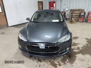 2014 Tesla Model S 60 with VIN 5YJSA1H16EFP52853, listed as a IAAI auction lot 41941989 with 132,038 mi miles and . Bid and sale history available at DreamBid. Image 12.