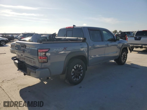 2022 Nissan Frontier Pro-X with VIN 1N6ED1EJ4NN647123, listed as a Copart auction lot 86296104 with 80,822 mi miles and Salvage title. Bid and sale history available at DreamBid. Image 3.