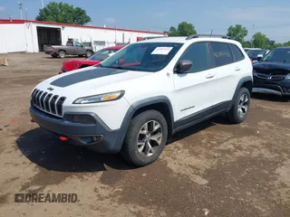 2014 Jeep Cherokee Trailhawk z VIN 1C4PJMBS0EW188976, wystawiony jako IAAI lot #42587233 z przebiegiem 191 670 mil mil oraz . Historia ofert i sprzedaży dostępna na DreamBid. Obrazek 2.