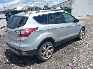 2017 Ford Escape Titanium with VIN 1FMCU0J99HUB23567, listed as a IAAI auction lot 42127795 with 93,056 mi miles. Bid and sale history available at carsss.com. Image 4.