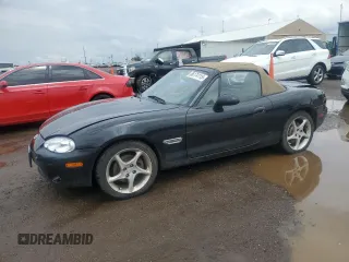 2003 Mazda MX-5 Miata Cloth z VIN JM1NB353X30304056, wystawiony jako Copart lot #56174115 z przebiegiem 89 457 mil mil oraz Szkoda całkowita • Salvage title. Historia ofert i sprzedaży dostępna na DreamBid. Obrazek 1.