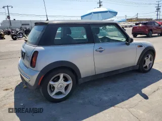 2003 MINI Hardtop with VIN WMWRC33453TE14909, listed as a Copart auction lot 65419725 with 111,960 mi miles and Salvage title. Bid and sale history available at DreamBid. Image 3.