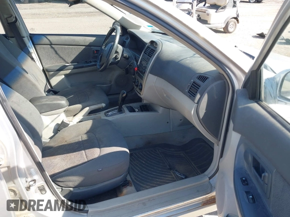 2006 Kia Spectra with VIN KNAFE161265317272, listed as a IAAI auction lot 42008875 with 169,983 mi miles. Bid and sale history available at carsss.com. Image 5.