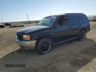 2000 GMC Denali with VIN 1GKEK13R8YR109690, listed as a Copart auction lot 76165584 with 153,366 mi miles and Salvage Title. Bid and sale history available at carsss.com. Image 1.
