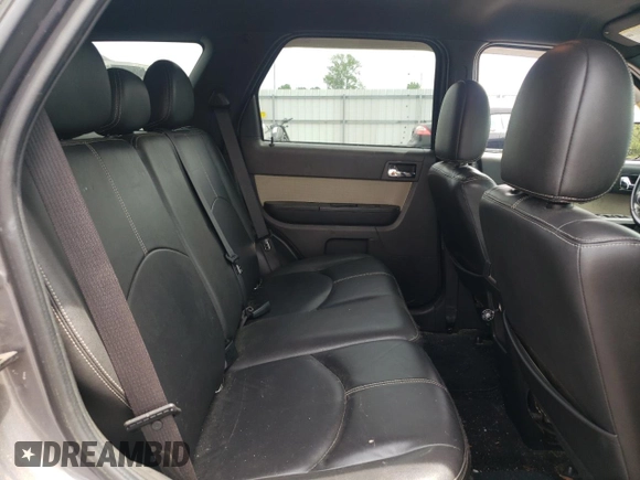 2011 Mercury Mariner Premier z VIN 4M2CN8HG8BKJ07653, wystawiony jako Copart lot #57495725 z przebiegiem 105 624 mil mil oraz Szkoda całkowita • Salvage title. Historia ofert i sprzedaży dostępna na DreamBid. Obrazek 11.