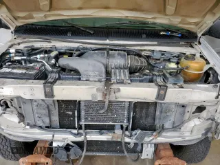 2001 Ford Econoline Cargo Recreational с VIN 1FDRE14L51HA62950, выставлен на аукционе Copart как лот 60860705 с пробегом 199 611 миль миль и Списание • Salvage title. История ставок и продаж доступна на DreamBid. Изображение 11.