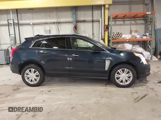 2016 Cadillac SRX Luxury Collection z VIN 3GYFNEE38GS565721, wystawiony jako IAAI lot #41963005 z przebiegiem 87 005 mil mil oraz . Historia ofert i sprzedaży dostępna na DreamBid. Obrazek 13.