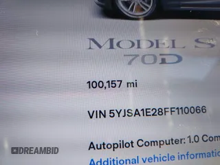 2015 Tesla Model S 85D with VIN 5YJSA1E28FF110066, listed as a IAAI auction lot 40672973 with 100,157 mi miles. Bid and sale history available at carsss.com. Image 16.