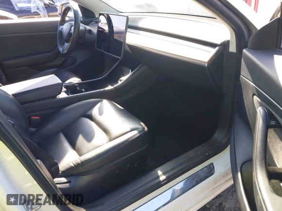 2020 Tesla Model 3 Standard Range Plus with VIN 5YJ3E1EA7LF797150, listed as a IAAI auction lot 41869088 with 75,708 mi miles and . Bid and sale history available at carsss.com. Image 5.