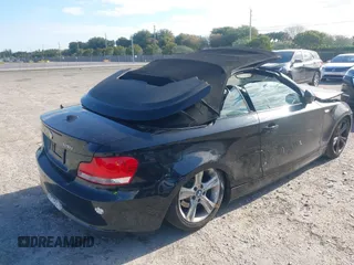 2011 BMW 1 Series 128i with VIN WBAUL7C54BVM80474, listed as a IAAI auction lot 42031032 with 76,617 mi miles and . Bid and sale history available at carsss.com. Image 4.