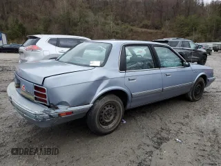 1994 Oldsmobile Cutlass Ciera S z VIN 1G3AG55M1R6362731, wystawiony jako Copart lot #83832424 z przebiegiem 145 973 mil mil oraz Szkody całkowita. Historia ofert i sprzedaży dostępna na DreamBid. Obrazek 3.