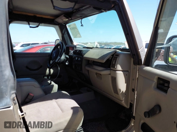2005 Jeep Wrangler Sport with VIN 1J4FA49S45P345673, listed as a IAAI auction lot 41830128 with 139,432 mi miles. Bid and sale history available at carsss.com. Image 5.