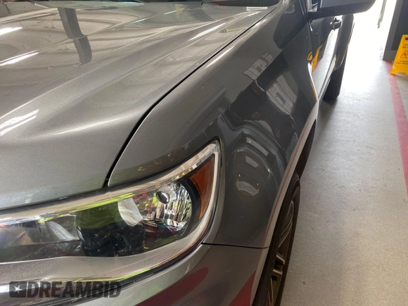 2021 Chevrolet Colorado 4WD Work Truck with VIN 1GCGTBEN0M1131662, listed as a IAAI auction lot 42788983 with 78,205 mi miles and . Bid and sale history available at DreamBid. Image 6.