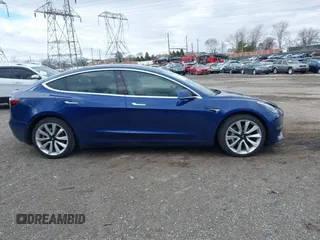 2020 Tesla Model 3 Long Range with VIN 5YJ3E1EB9LF601198, listed as a IAAI auction lot 41744287 with 70,322 mi miles and . Bid and sale history available at DreamBid. Image 14.