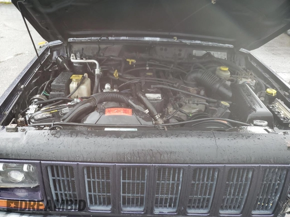1999 Jeep Cherokee Sport with VIN 1J4FF68S6XL602177, listed as a Copart auction lot 51962355 with 176,386 mi miles and Salvage Title. Bid and sale history available at carsss.com. Image 12.