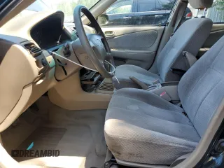 1999 Toyota Corolla VE with VIN 1NXBR12E7XZ240321, listed as a Copart auction lot 64259115 with 144,145 mi miles and Salvage title. Bid and sale history available at DreamBid. Image 7.