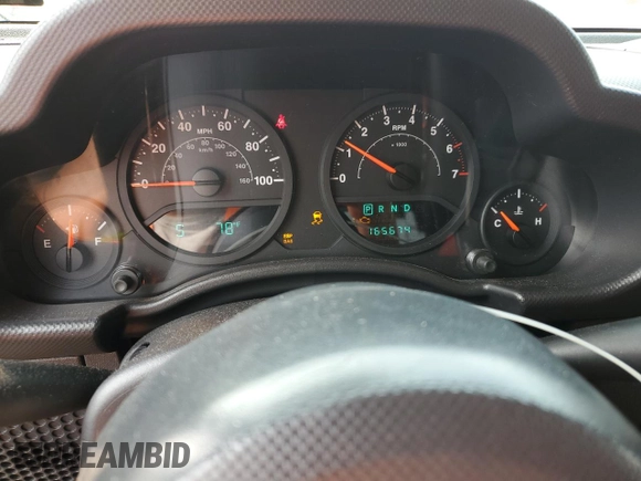 2007 Jeep Wrangler Unlimited X z VIN 1J4GA391X7L169728, wystawiony jako Copart lot #59484265 z przebiegiem 165 674 mil mil oraz Szkoda całkowita • Salvage title. Historia ofert i sprzedaży dostępna na DreamBid. Obrazek 9.