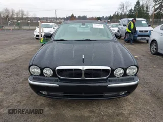 2004 Jaguar XJ with VIN SAJWA71C94SG29019, listed as a IAAI auction lot 41664978 with 133,546 mi miles. Bid and sale history available at carsss.com. Image 6.