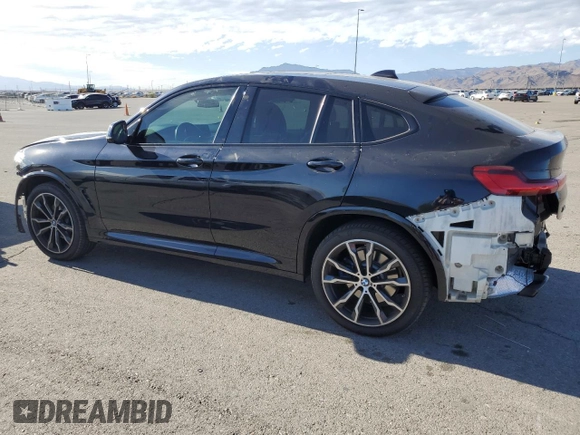 2021 BMW X4 M40i with VIN 5UX2V5C06M9E04443, listed as a Copart auction lot 72061194 with 71,637 mi miles and Salvage title. Bid and sale history available at DreamBid. Image 2.