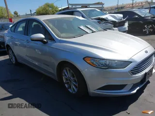 2017 Ford Fusion Hybrid SE z VIN 3FA6P0LU9HR218007, wystawiony jako IAAI lot #42781347 z przebiegiem 97 330 mil mil oraz . Historia ofert i sprzedaży dostępna na DreamBid. Obrazek 1.