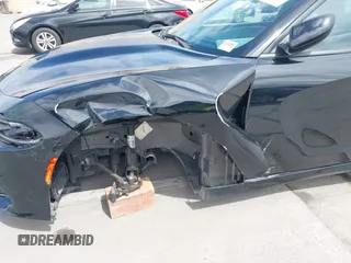 2021 Dodge Charger R/T with VIN 2C3CDXCT4MH651945, listed as a IAAI auction lot 41861896 with 25,569 mi miles and . Bid and sale history available at carsss.com. Image 17.