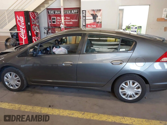 2010 Honda Insight LX with VIN JHMZE2H54AS040316, listed as a IAAI auction lot 41572246 with 142,850 mi miles and . Bid and sale history available at DreamBid. Image 14.