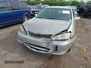 2004 Toyota Camry LE with VIN 4T1BE32K84U374943, listed as a IAAI auction lot 42038382 with 323,419 mi miles. Bid and sale history available at carsss.com. Image 6.