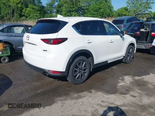 2018 Mazda CX-5 Grand Touring z VIN JM3KFBDM8J0420422, wystawiony jako IAAI lot #42188348 z przebiegiem 102 216 mil mil oraz . Historia ofert i sprzedaży dostępna na DreamBid. Obrazek 4.