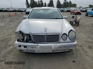 1999 Mercedes-Benz E-Class with VIN WDBJF65H0XA797390, listed as a Copart auction lot 55081405 with 80,950 mi miles and Salvage Title. Bid and sale history available at carsss.com. Image 5.