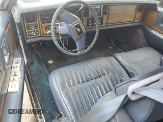 1984 Cadillac Eldorado z VIN 1G6AL5783EE654296, wystawiony jako Copart lot #74945374 z przebiegiem 37 040 mil mil oraz Szkody całkowita. Historia ofert i sprzedaży dostępna na DreamBid. Obrazek 8.