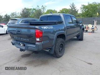 2019 Toyota Tacoma SR with VIN 3TMCZ5AN3KM207783, listed as a IAAI auction lot 42375280 with 55,784 mi miles and . Bid and sale history available at DreamBid. Image 4.
